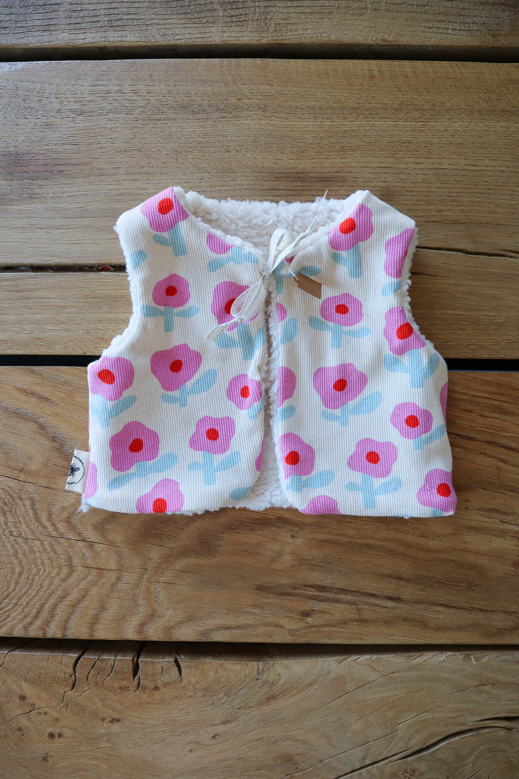 Gilet de berger bébé & enfant réversible – Motifs fleurs rose et bleu