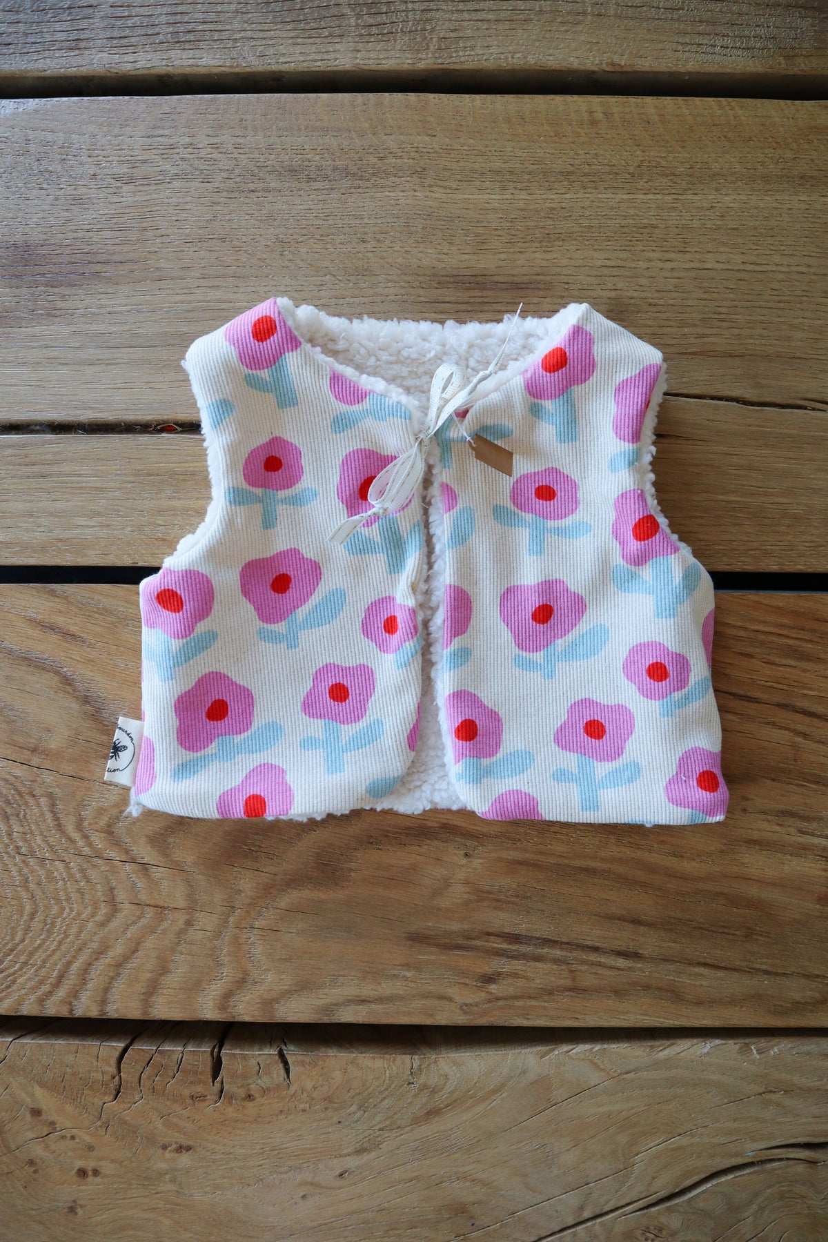 Gilet de berger bébé & enfant réversible – Motifs fleurs rose et bleu