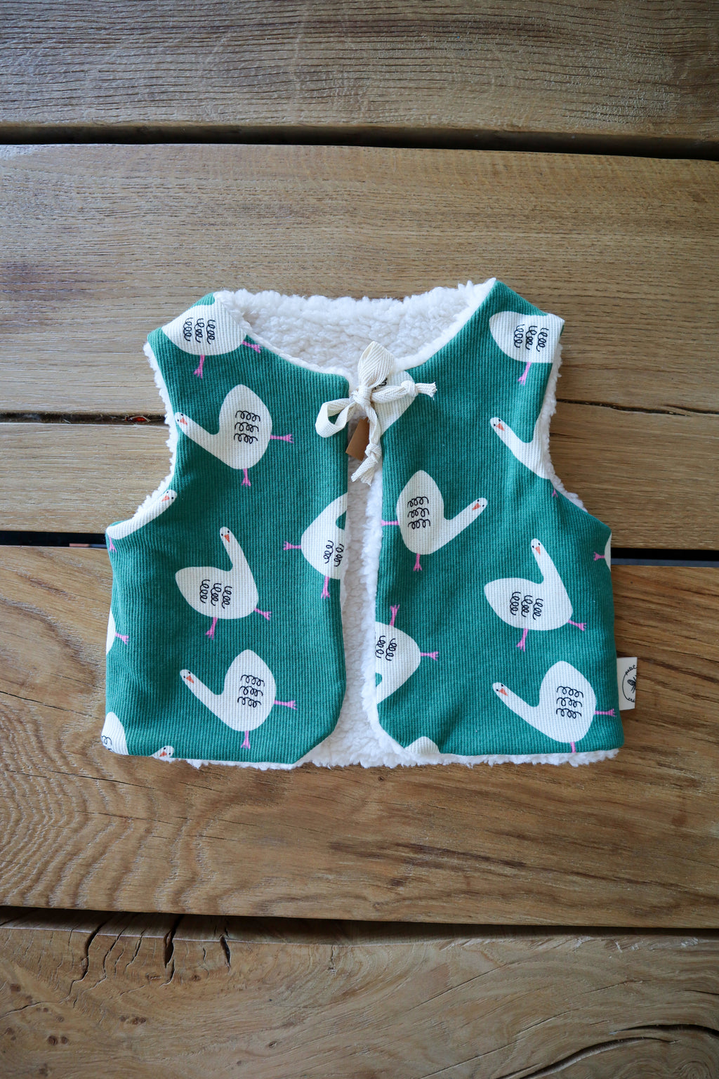 Gilet de berger bébé & enfant réversible – Motifs oies sur fond vert