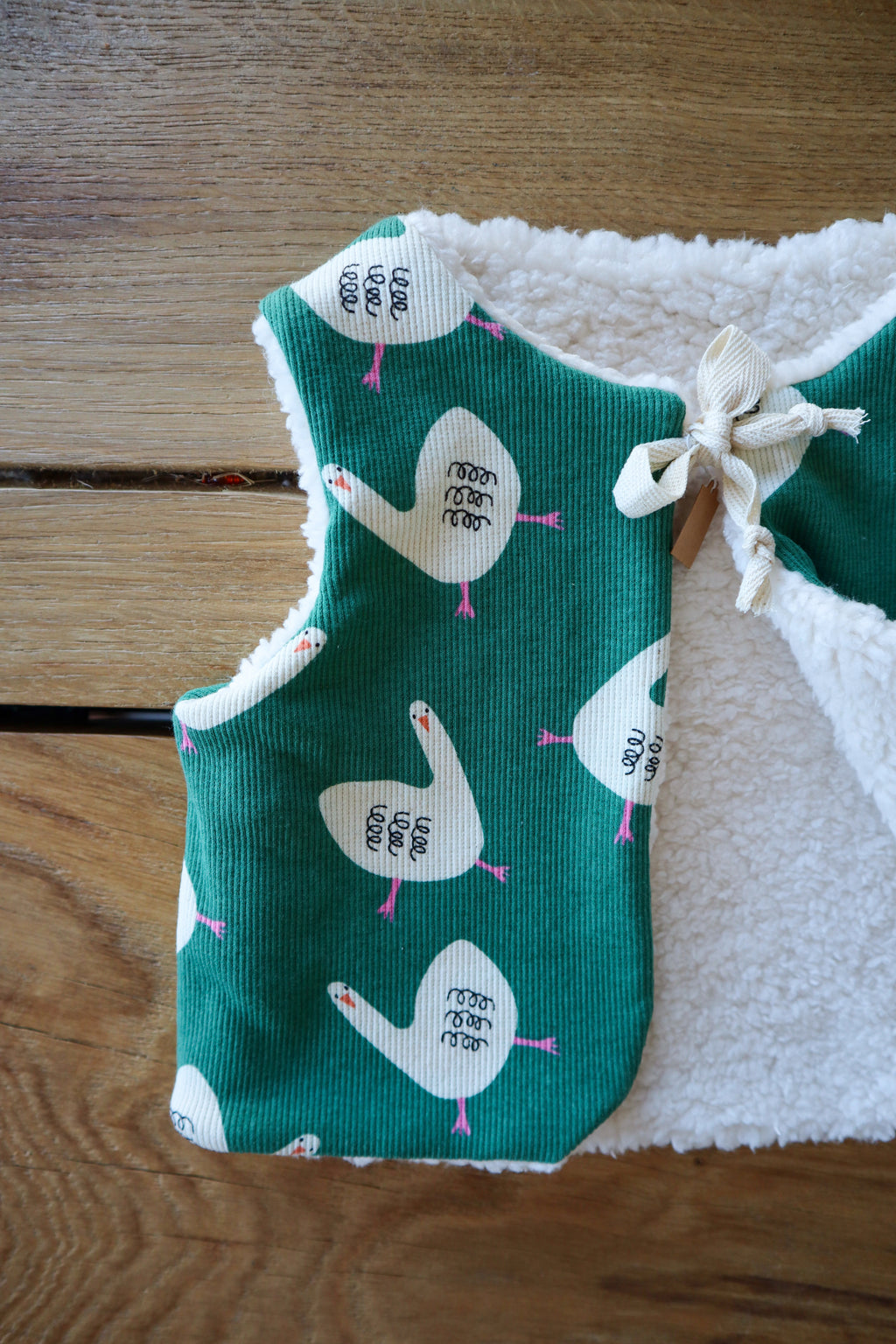 Gilet de berger bébé & enfant réversible – Motifs oies sur fond vert