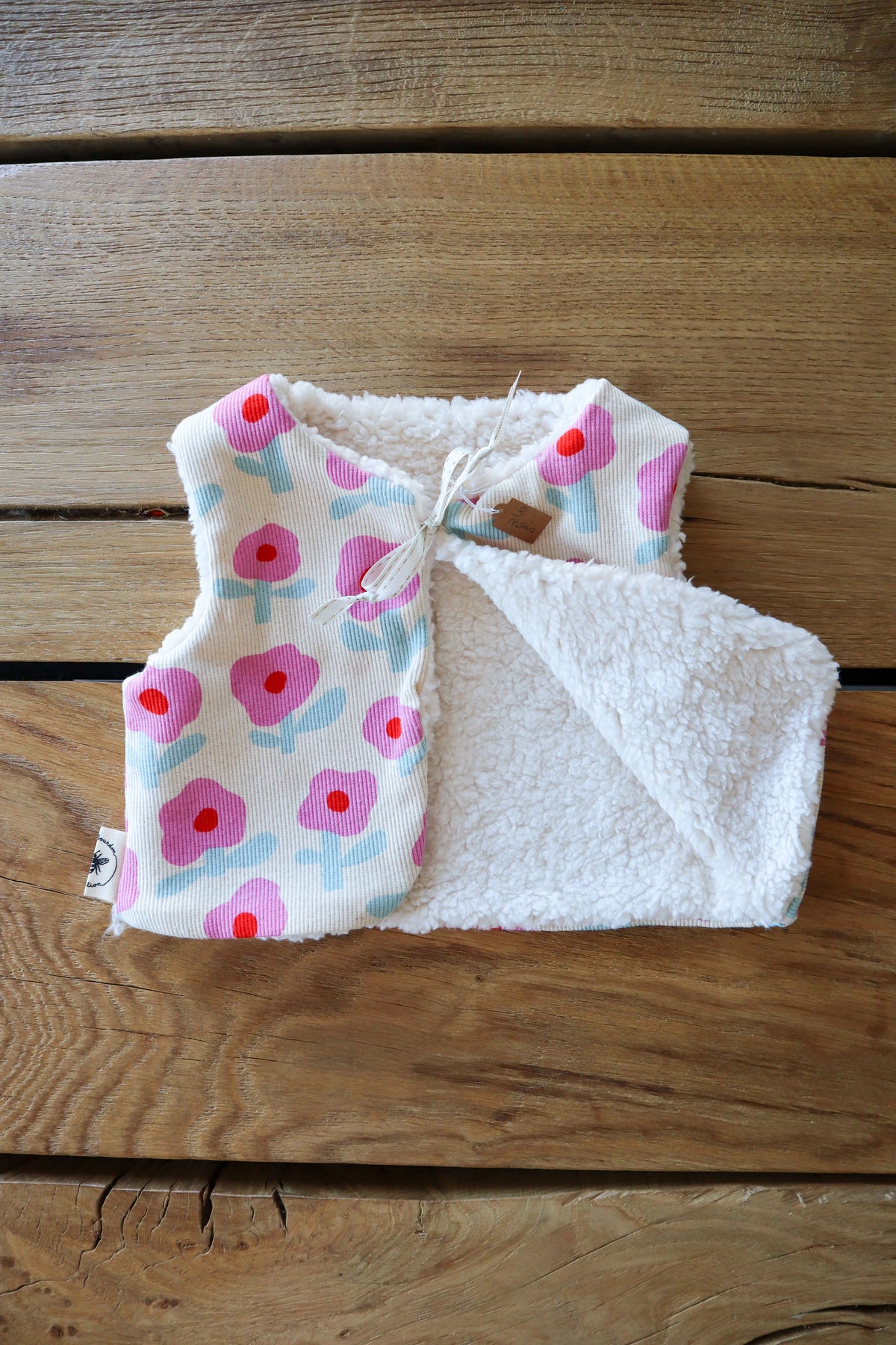 Gilet de berger bébé & enfant réversible – Motifs fleurs rose et bleu